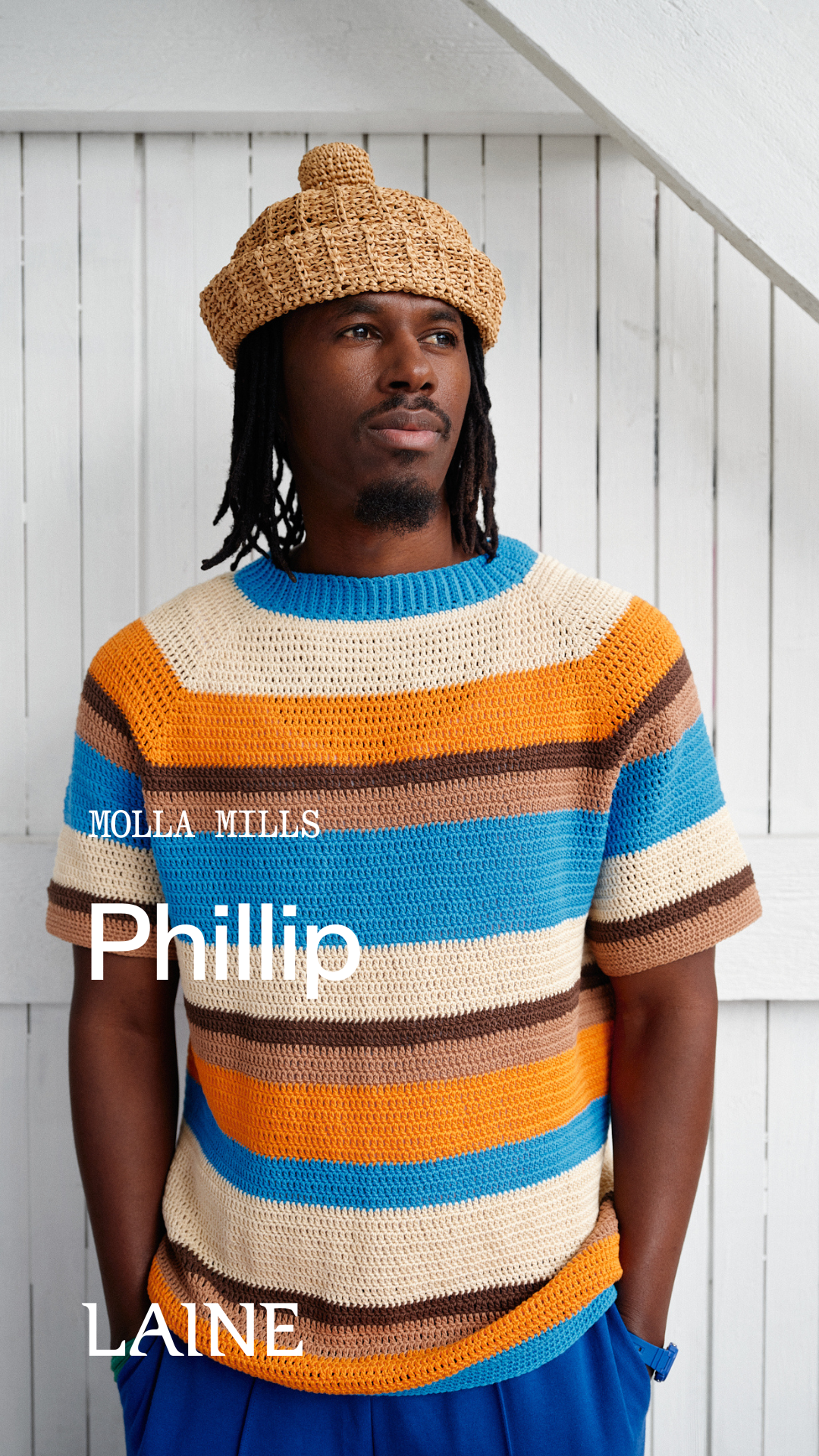 Man wearing a striped Phillip sweater and a Phyllis hat designed by Molla Mills 