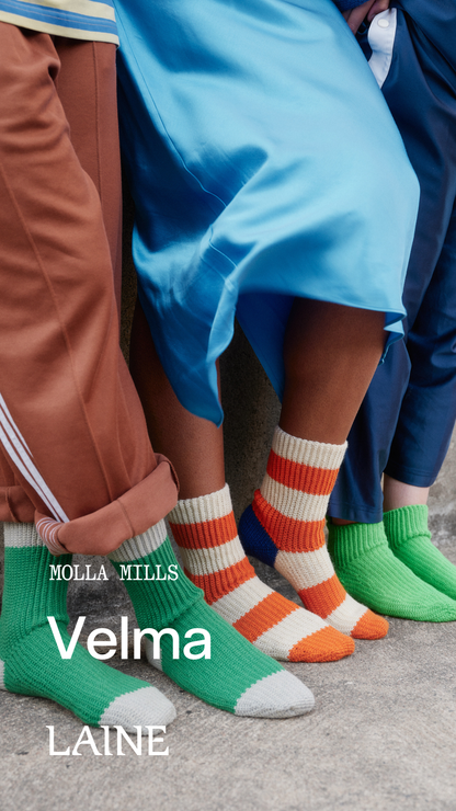 Colorful Velma socks designed by Molla Mills worn by people 