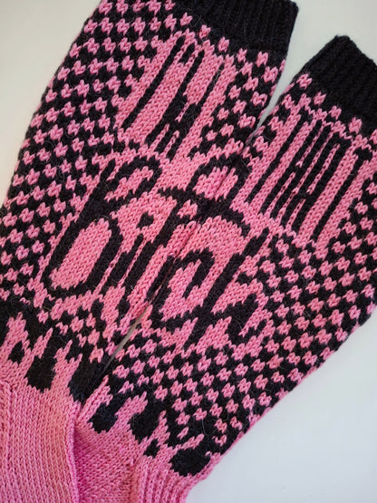 Pink and black patterned socks with the text "I'm that bitch" on a white background