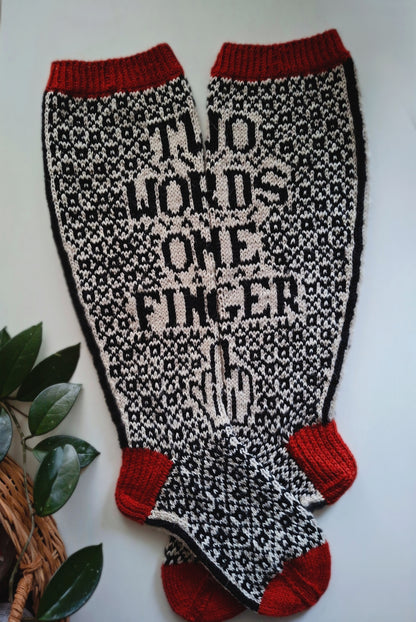 Socks with 'Two Words One Finger' text and red accents on a white background
